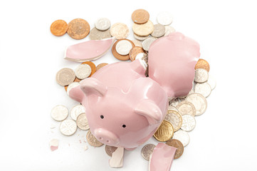 Break the bank, economic downturn and bankruptcy concept theme with a broken piggy bank and...
