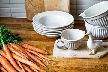 carrots and and plates in kitchen 