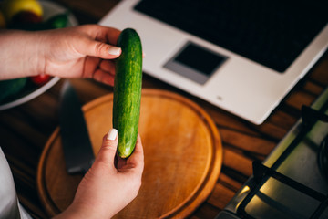 Healthy food, online recipe, culinary video blog. Overweight woman blogger recording cooking video in her kitchen