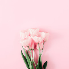 Fototapeta na wymiar Beautiful composition spring flowers. Bouquet of pink tulips flowers on pastel pink background. Valentine's Day, Easter, Happy Women's Day, 8th march, Mother's Day. Flat lay, top view, copy space