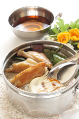 Chinese food, fried egg and chicken wings on rice packed lunch