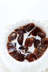 Asian food, black tea jelly served milk in bowl for gourmet dessert