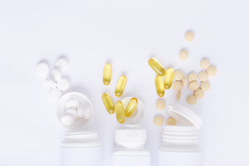 Assorted pharmaceutical medicine vitamins, pills, drugs on white background