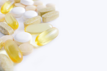 Fototapeta na wymiar Assorted pharmaceutical medicine vitamins, pills, drugs on white background