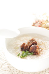 Chinese food, spicy beef jerky on rice porridge with copy space