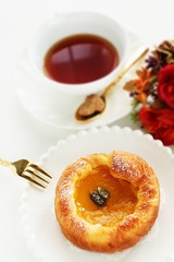 Pumpkin Danish pastry on white background with copy space