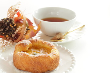 Pumpkin Danish pastry on white background with copy space