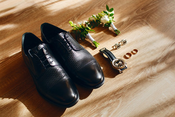 Men's accessories in the form of clothes, shoes, rings and cufflinks, boutonnieres from fresh...