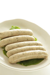 Boiled pork and herbal sausage on dish