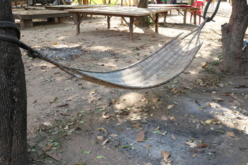Kampong Thom, Cambodia-January 25, 2020: A handmade cane or wicker hammock in Kampong Thom, Cambodia