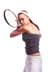 Sport Ideas. Portrait of Aggressive Caucasian Female Tennis Player in Sport Outfit Posing With Racket Against White.