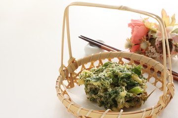 Homemade Japanese udon noodles and green leaves tempura