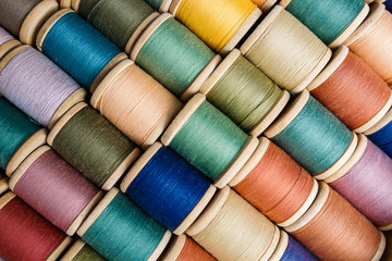 rolls of colorful threads, close-up and top view.