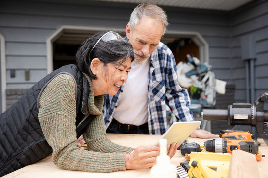 Senior couple using digital tablet for DIY tips