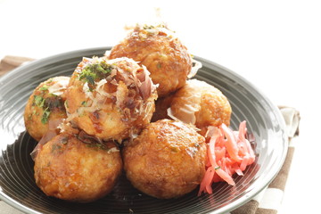 Japanese food, takoyaki octopus ball on dish and sauce