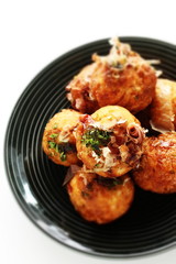 Japanese food, takoyaki octopus ball on dish and sauce