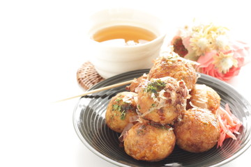 Japanese food, takoyaki octopus ball on dish and sauce
