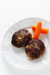 Homemade  hamburger patty and carrot for comfort food