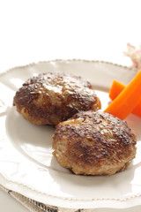 Homemade  hamburger patty and carrot for comfort food