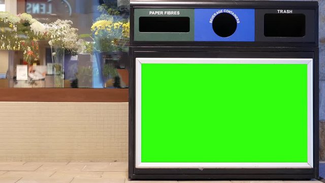 Motion of big green screen board on trash can inside shopping mall with 4k resolution