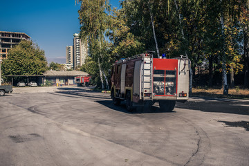 Fire engine leaving the garage of the fire station