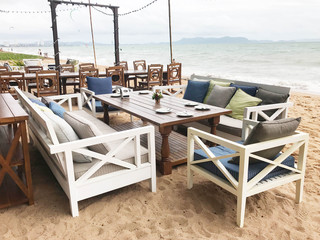 Empty dining set sofa beach at the sea for relax and vacation