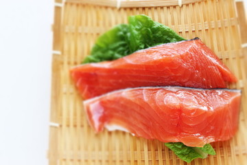 Freshness salmon fish on bamboo basket with copy space