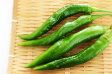 Japanese green pepper on bamboo basket for cooking image