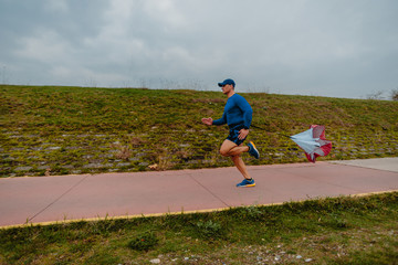 Fototapeta premium Running with speed resistance. Workout outdoors