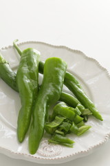 Japanese green pepper on plate for cooking image