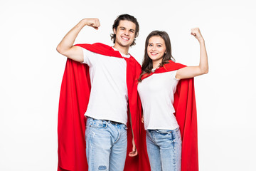 Obraz premium Young couple wear in super hero cout show the power isolated on white background