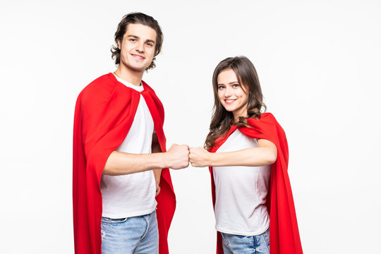 Young couple super hero with fist together isolated on white background