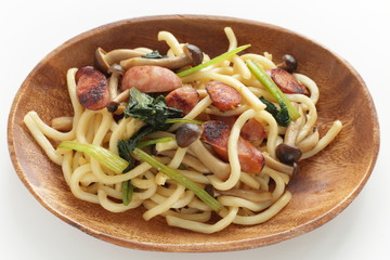 Japanese comfort food, sausage and spinach fried udon noodles