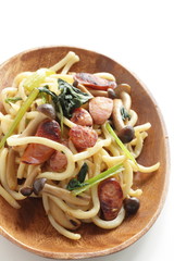 Japanese comfort food, sausage and spinach fried udon noodles