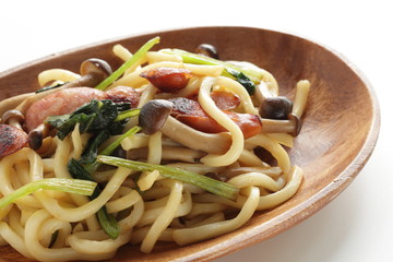 Japanese comfort food, sausage and spinach fried udon noodles