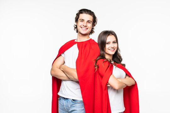 Super couple in masks and cloaks standing with hands on waist and looking at camera isolated on white background