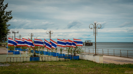 Obraz na płótnie Canvas Many flags in a seaside park in Thailand
