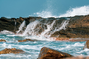 Waves crashing on rocks
