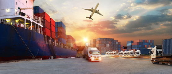 Container truck in ship port for business Logistics and transportation of Container Cargo ship and...