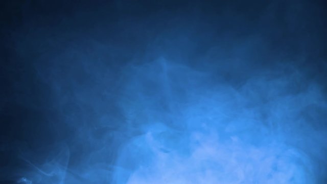 Blue smoke in gray background. Realistic dry ice smoke clouds fog overlay perfect for compositing into your shots. Simply drop it in and change its blending mode to screen or add.