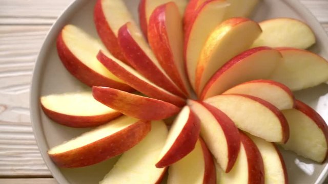 fresh red apple slice on plate