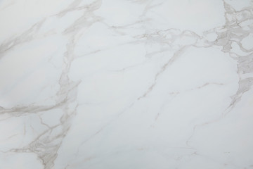White marbled tile, close up photo on marbled tile surface.