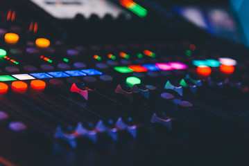 Obraz na płótnie Canvas Closeup of an audio mixing control panel