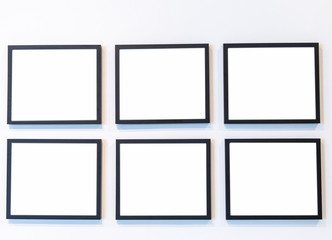 set of frames on the wall