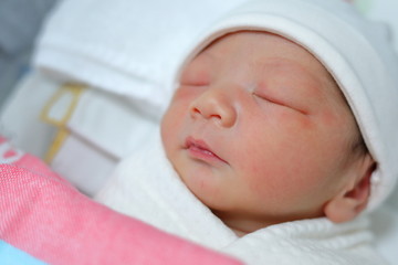 cute little newborn baby sleeping sweet dream in soft blanket