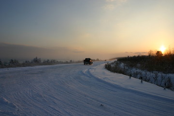 sunset over frozen sea