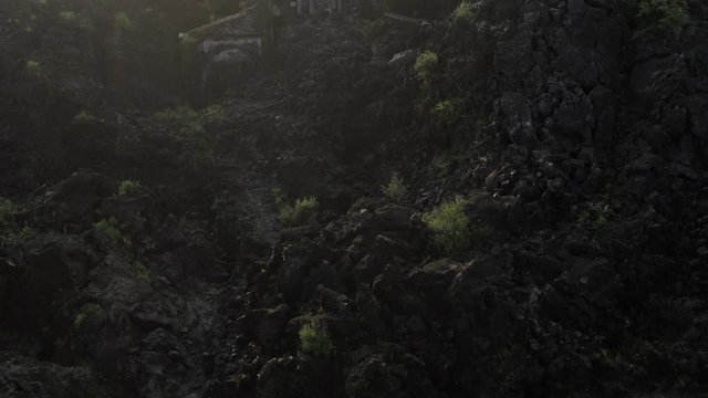 Aerial dolly out shot of church ruins, Paricutin.