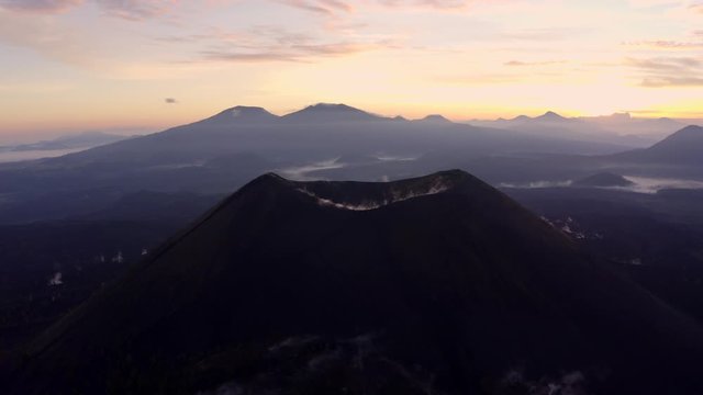 Aerial shot of a volcano at sunrise