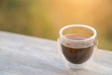 hot black coffee in glass with nature mountain view 