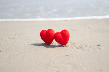 Fototapeta premium Red heart on a sandy beach. concept Valentine day